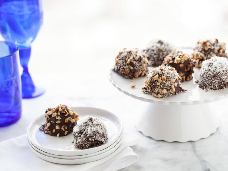 Kosher for Passover Chocolate Covered Marble Cake Bites - Kosher for Passover cake bites covered in dark chocolate and dipped in chopped nuts, sweetened coconut or any topping you'd like! From Heidi Larsen of FoodieCrush.