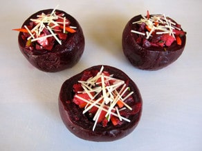 Cheese on top of beet salad.
