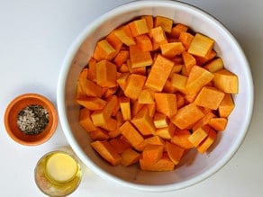 Diced butternut squash in a mixing bowl.