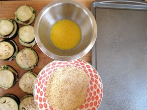 Bowls of egg and panko for breading eggplant.