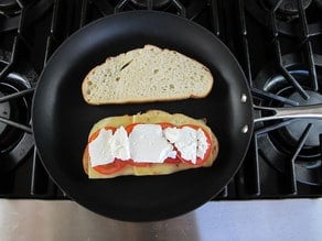 Feta cheese on top of sourdough in a skillet.