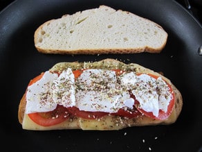 Spices sprinkled over feta cheese.