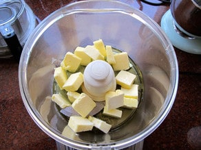 Sliced butter in the food processor.