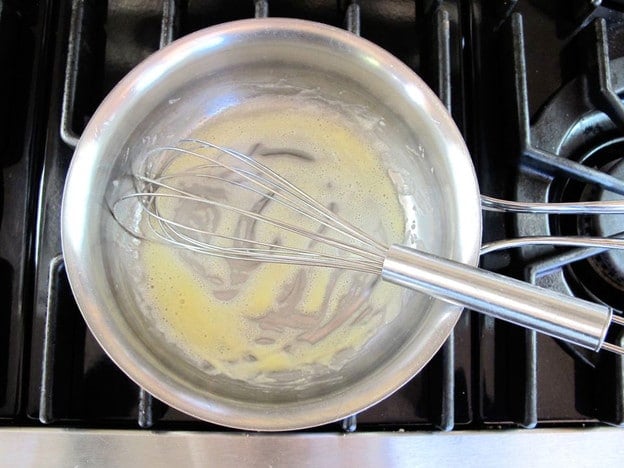 Making a roux in a saucepan.