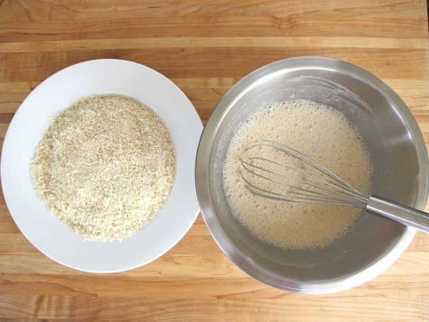Bowls of batter and breading for fish.
