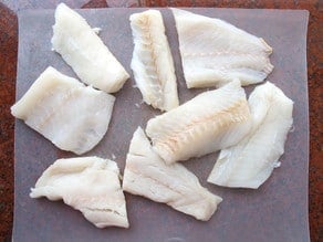 White fish cut into fillets.