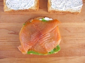 Lettuce and smoked salmon on a slice of toast.