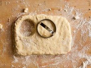 Cutting out biscuits.