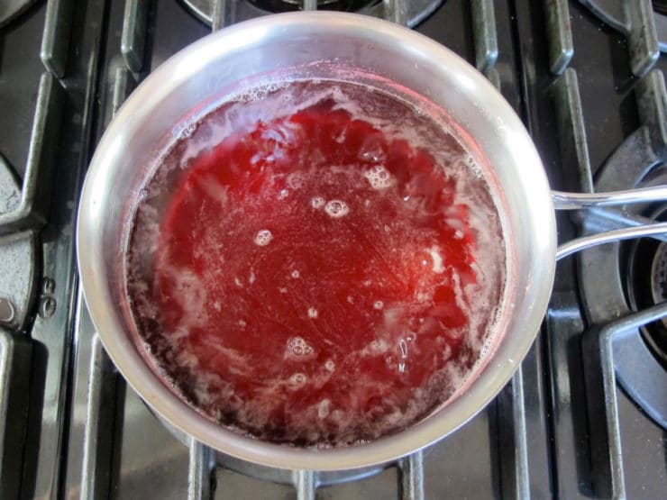 Reducing simple syrup in a saucepan.