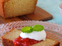 Almond Ricotta Pound Cake topped with strawberry sauce and mint leaves