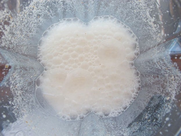 Soaked almonds processed in a blender.