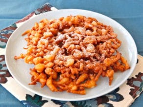 Funnel Cake - Learn the history of funnel cake, from medieval Anglo-Norman times to present, and try a tasty traditional Pennsylvania Dutch recipe from 1916.