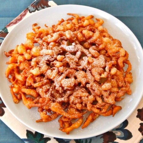 Funnel Cake - Learn the history of funnel cake, from medieval Anglo-Norman times to present, and try a tasty traditional Pennsylvania Dutch recipe from 1916.