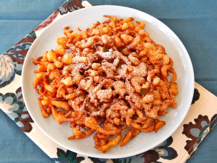 Funnel Cake - Learn the history of funnel cake, from medieval Anglo-Norman times to present, and try a tasty traditional Pennsylvania Dutch recipe from 1916.