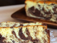 A delicious chocolate marble cake on a plate, showcasing a beautiful swirl pattern of chocolate and vanilla