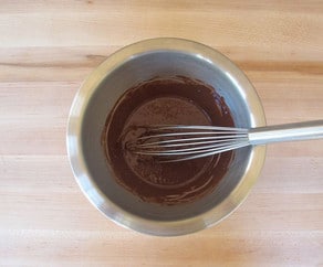 Cocoa powder whisked into warm water.