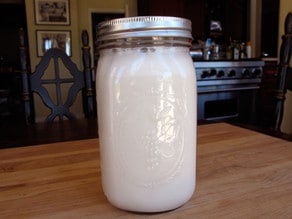 Strained almond milk in a jar.
