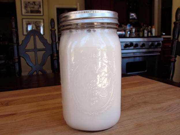 Strained almond milk in a jar.