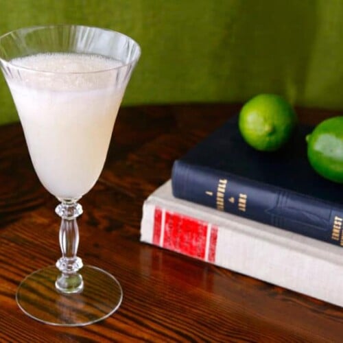 A classic Hemingway Special Daiquiri cocktail in a chilled glass with a lime wedge garnish