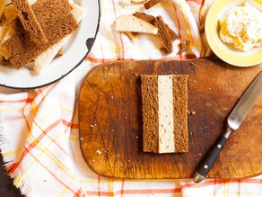 Lining up slices of rye bread in alternating colors.