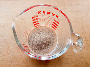 Yeast proofing in a measuring cup.