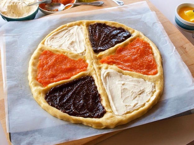 Round kolache sections filled with fruit.