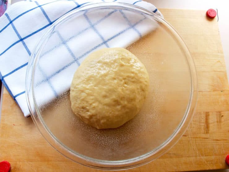 Kolache dough in an oiled mixing bowl.
