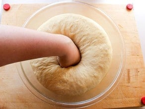 Punching down kolache dough.