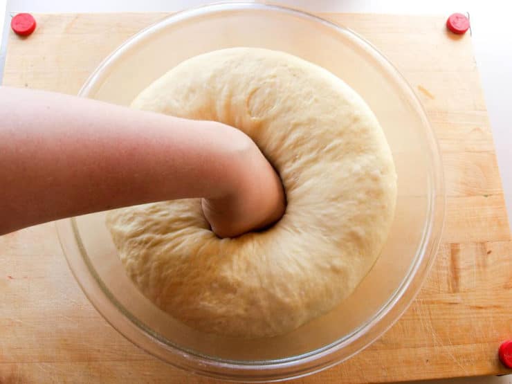Punching down kolache dough.