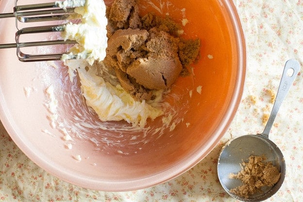 Beating butter in a mixing bowl.