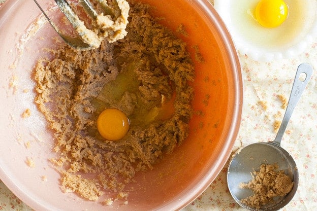Beating eggs into cake batter.
