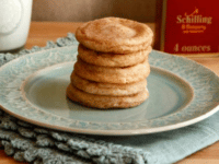 Cinnamon sugar cookies on a plate, accompanied by a glass of milk