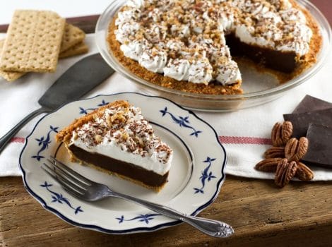 Chocolate Icebox Pie - Learn to make Chocolate Icebox Pie topped with whipped cream and nuts from the vintage 1950's cookbook, Recipes from Old Virginia.