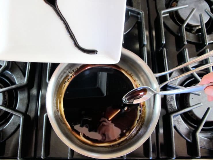 Balsamic reduction in a small pot.