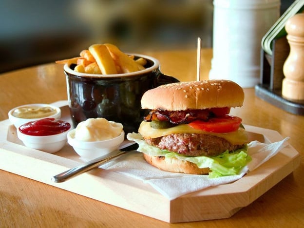 A Brief History of Hamburgers - Learn the origins of America\'s favorite sandwich, the hamburger! From German immigrants to roadside diners, burgers are a uniquely American treat.