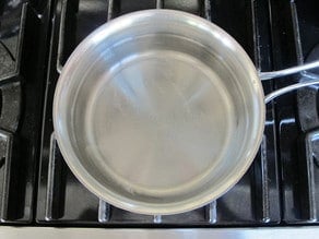 Making brine in a saucepan.