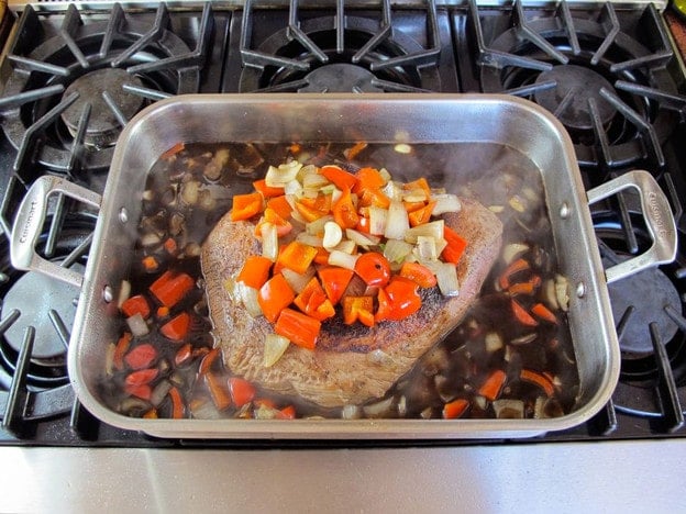 Beef brisket in roasting dish.