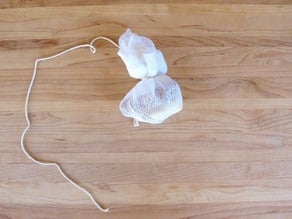 Spices tied in cheesecloth on a string.