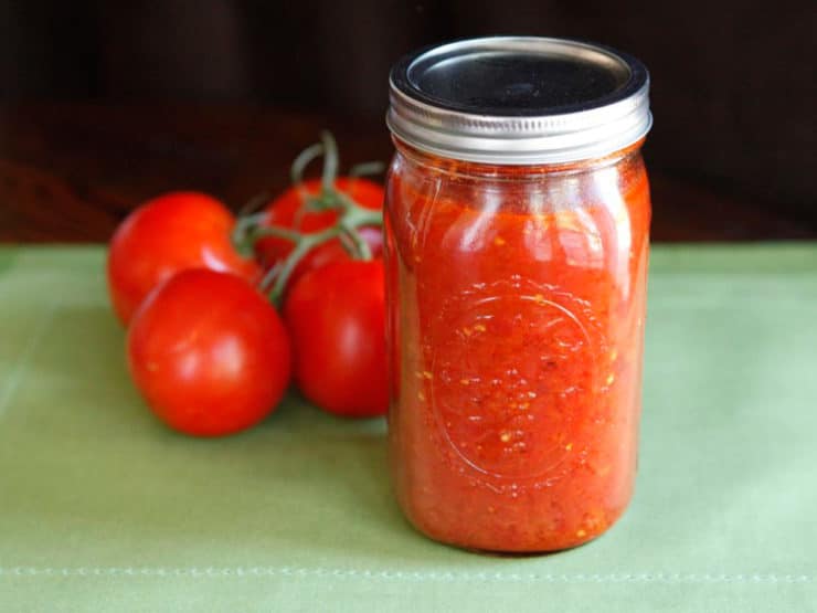 Basic Roasted Tomato Sauce - Step by step recipe for tomato sauce and instructions for processing using a pressure canner. Simple sauce made of tomatoes, olive oil, sugar and salt. 