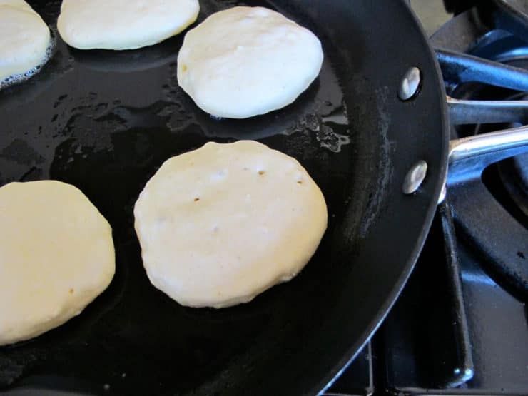 Griddle cakes in a skillet.