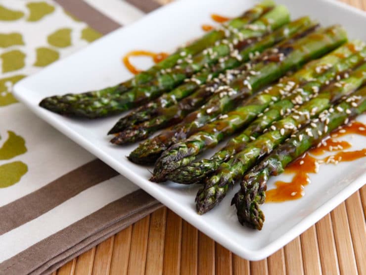 Roasted Sesame Asparagus - Roasted asparagus drizzled with a sesame-flavored sweet and spicy sauce and sprinkled with sesame seeds. Kosher, pareve, healthy, simple recipe.