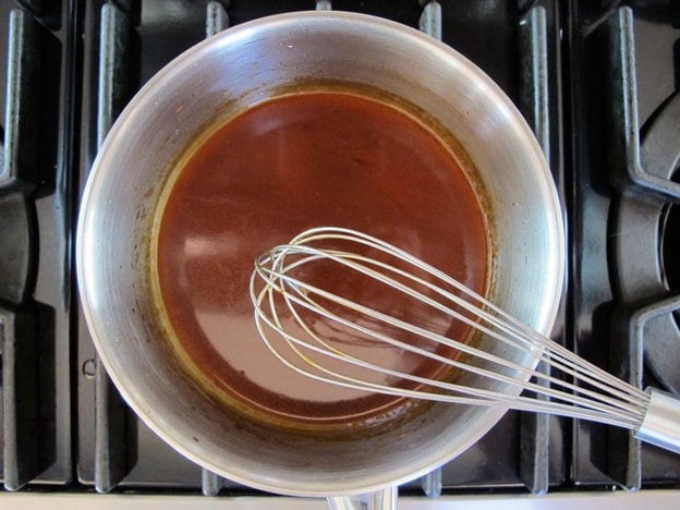 Sesame dressing in a small pot.