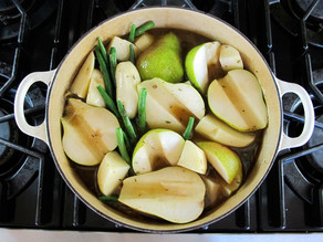 Pear halves added to stockpot of stew.