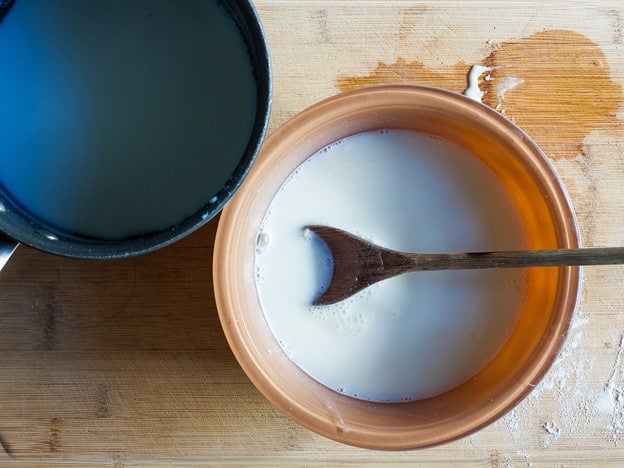 Steeping vanilla in milk and sugar.