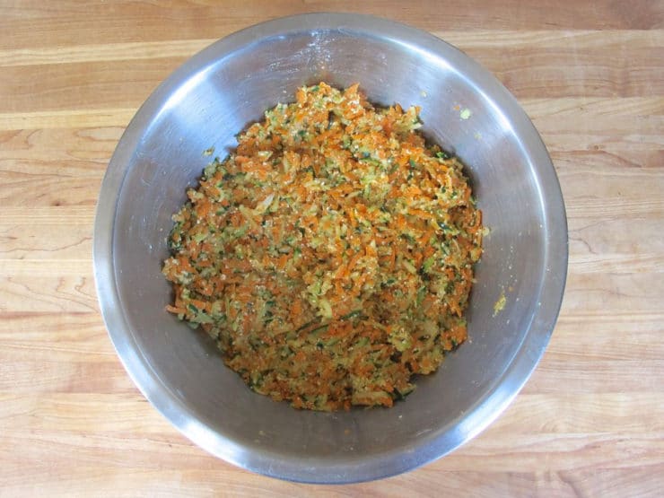 Shredded vegetables in a large mixing bowl.