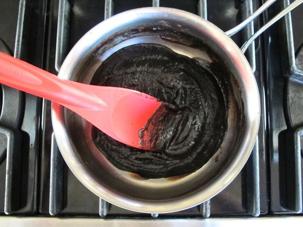 Heating date dressing in a small pot.