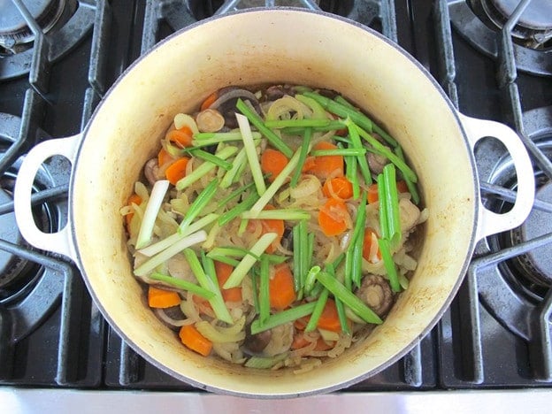Green onions added to stock pot.