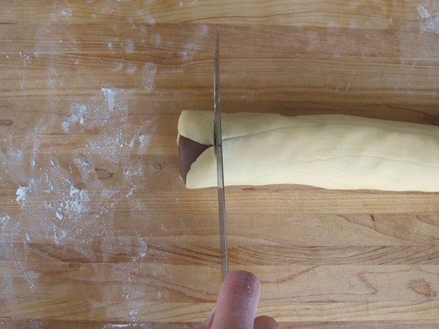 Slice off uneven ends of dough log.
