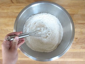 Whisk flour and dry ingredients in a mixing bowl.