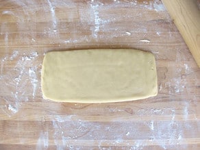 White dough rolled into a rectangle.